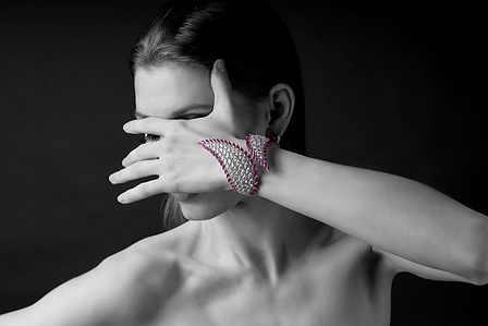 black and white model poses with signature diamond bangles designed by top jewellery designer from mumbai yoube jewellery shoot with the best fashion photographer based in mumbai india