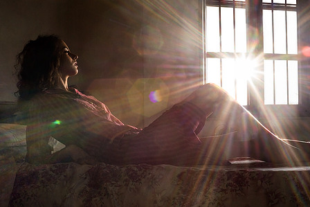 girl waking up to bright sunrays in a creative concept shoot with one of the most talented jewellery photographers based in pune india