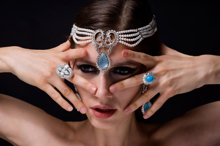 female model posing with diamond jewelry rings and headpiece shot by best Indian jewelry photographer based in pune india 