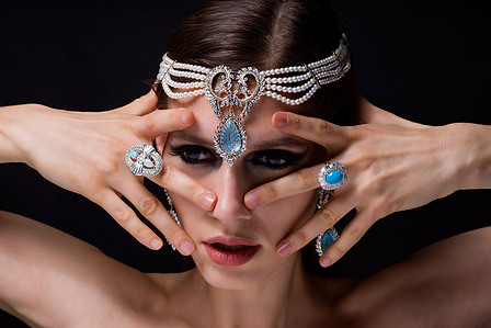 female model posing with diamond jewelry rings and headpiece shot by best Indian jewelry photographer based in pune india 