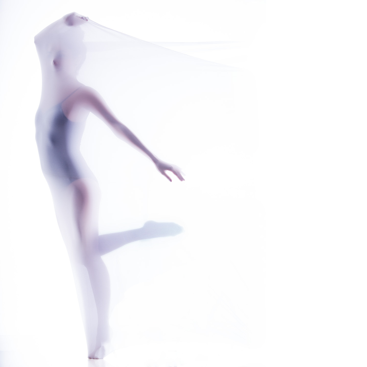 female model giving dancing pose while covered in lycra for concept based photoshoot by leading fashion photographer based in mumbai india