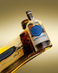 concept based luxury advertising photographer shoot rum bottle on mirror in studio lighting setup pune india