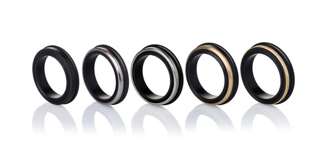 a professional photoshoot of black metal rings shot in studio setup with a white background by leading still life photographer ashish gurbani based in mumbai india