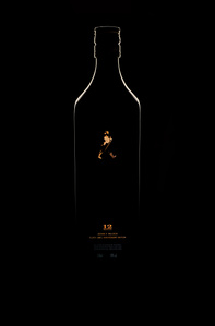 a professional dark concept product photoshoot of a Johnnie walker limited edition bottle taken in a studio setting by the best creative product photographer ashish gurbani based in Pune India