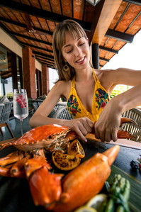 gorgeous lady enjoying some crab in a luxury hotel property westin goa for a brand advertising photography campaign shot by leading advertising photographer based in pune india