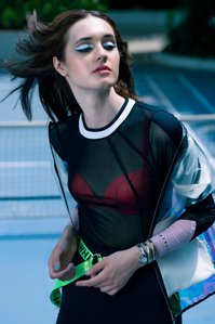 leading fashion model posing in designer clothing concept shoot on tennis court photography by top fashion photographer based in mumbai india