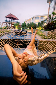 a female model laying down in a cozy comfortable hammock enjoying the hotel property and beautiful sunset in westin goa shot by top product photographer based in mumbai india