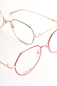 a white background photograph of two eyewear by luxury brand marc jacobs was placed in a creative manner by the best luxury photographer based in pune india