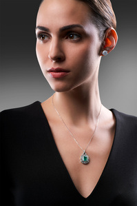 a luxury jewellery photography shoots portrait of a fashion model wearing solitaire diamond earring and necklace for campaign shoot in mumbai studio near me