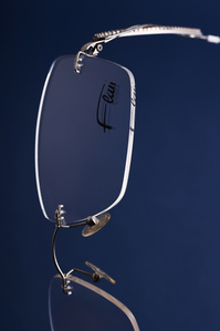 a luxury brand flare eyewear sunglasses shot on blue background by a conceptual photographer for an advertising photography campaign based in pune india