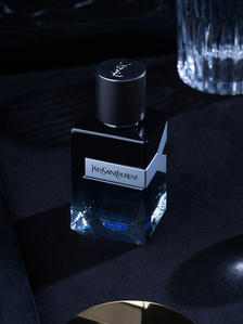 a dark monochrome perfume bottle by leading brand ysl photo and video studio near me in Pune india 