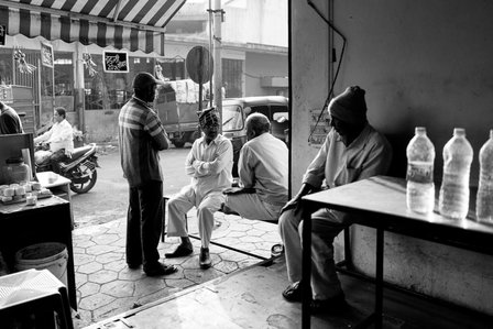 early morning 7am conversations in a tea stall by best indian street photographer