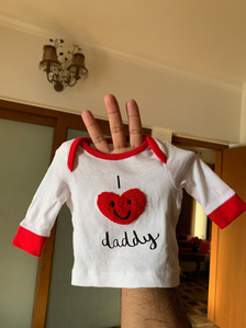 photograph of a baby's t-shirt shot at home by leading fashion photographer ashish gurbani based In Mumbai india