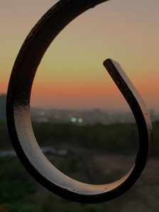 professional shot of the sunset through the balcony grill taken by leading advertising photographer ashish gurbani based in Mumbai india