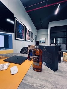 prepping a photoshoot for whiskey bottles in the studio by leading product photographer based in pune india