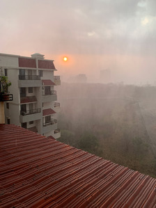 photograph in an outdoor setting of rain and hail storm pouring down with the sunset peaking through shot by leading product photographer ashish gurbani based in Mumbai india