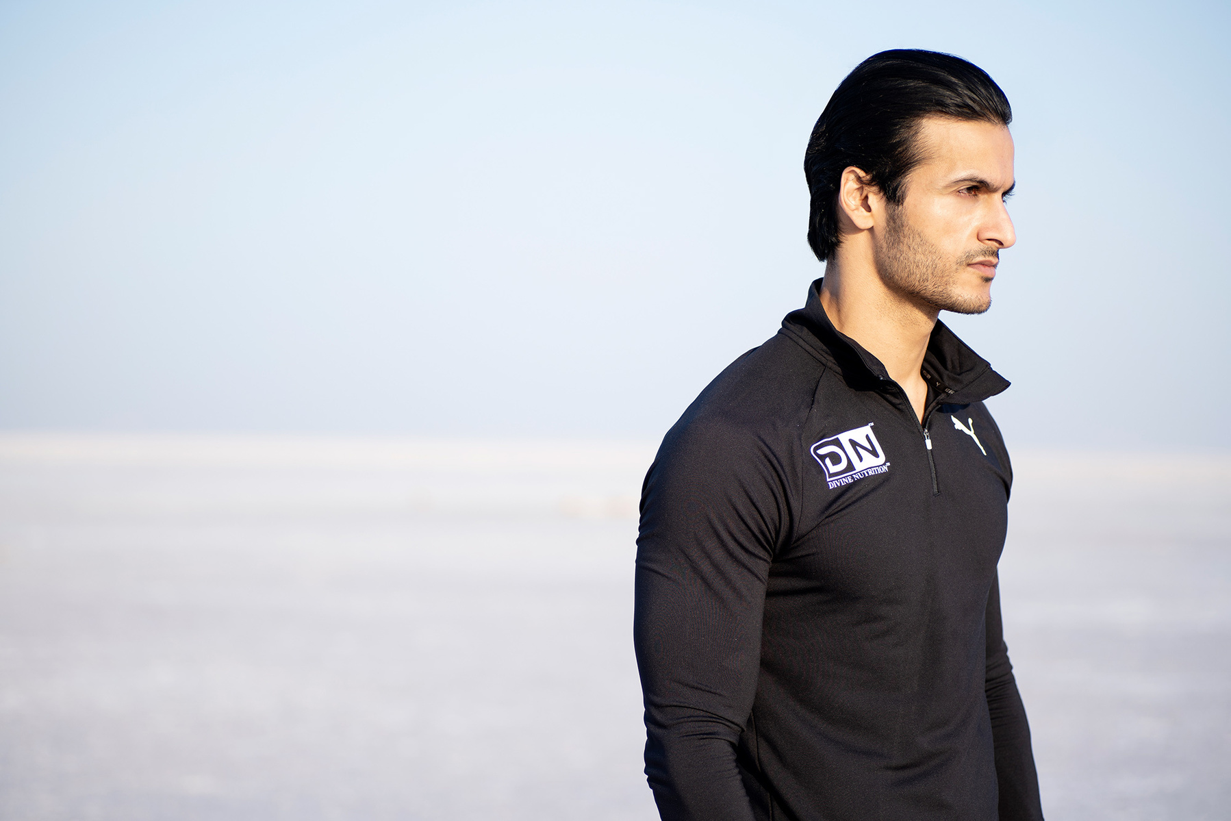 male fitness model posing at the rann of kutchch in Gujarat india for golds gym leading gym brand photoshoot with the best fashion photographer based in mumbai india