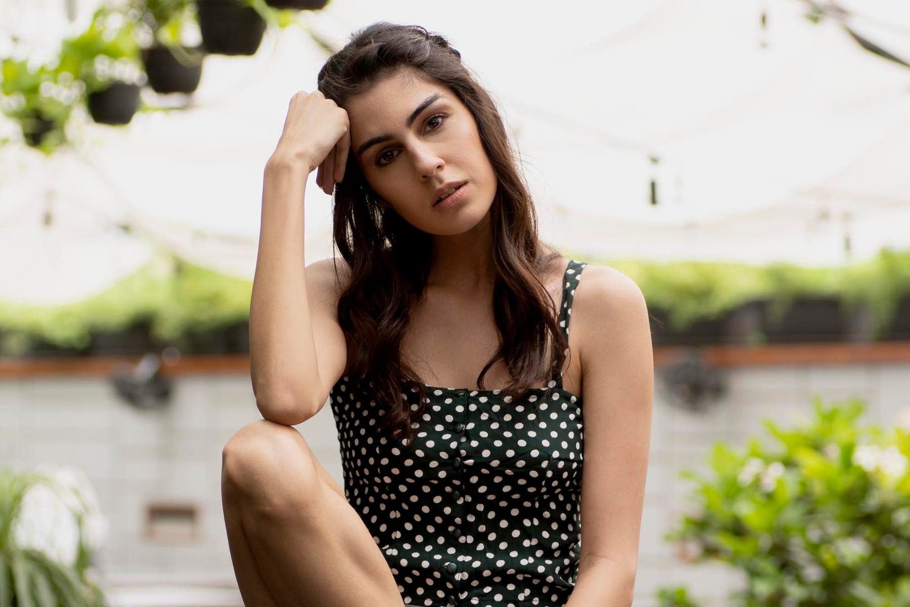 female model posing indian in garden with green plants portrait shot by top indian fashion photographer studio in santacruz mumbai