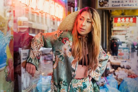 Russian blonde model standing against window wearing chinese ethnic clothing based in New York shot by most creative fashion and advertising photographer from Mumbai Santacruz Mumbai