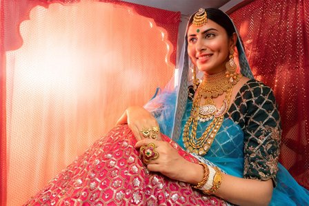 female model sitting inside dhole wearing indian bridal jewellery for jewellery advertising campaign shoot by top indian fashion photographer based in mumbai