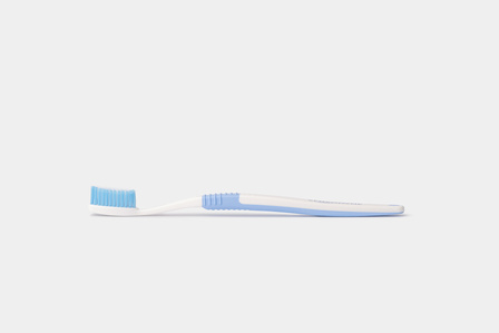 a side angle professional product photoshoot of a toothbrush on plain white background for a website layout shot by leading still life photographer ashish gurbani based in pune and mumbai india
