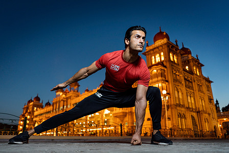 stretches by the beautiful sunset at mysore palace photography by the leading indian fitness advertising photographer based in mumbai india.
