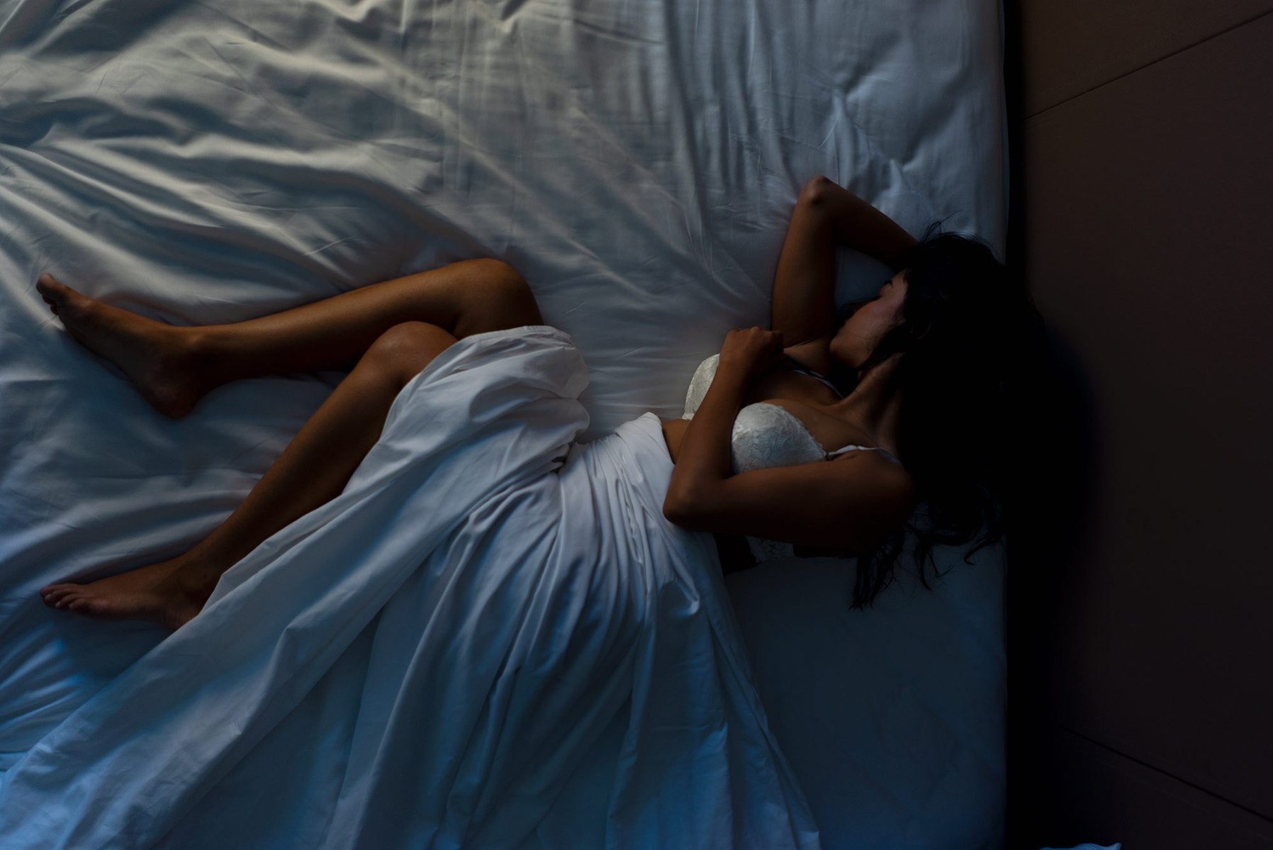 girl lying in bed suffering from anxiety and depression photography ideas shoot by top advertising photographer in mumbai india