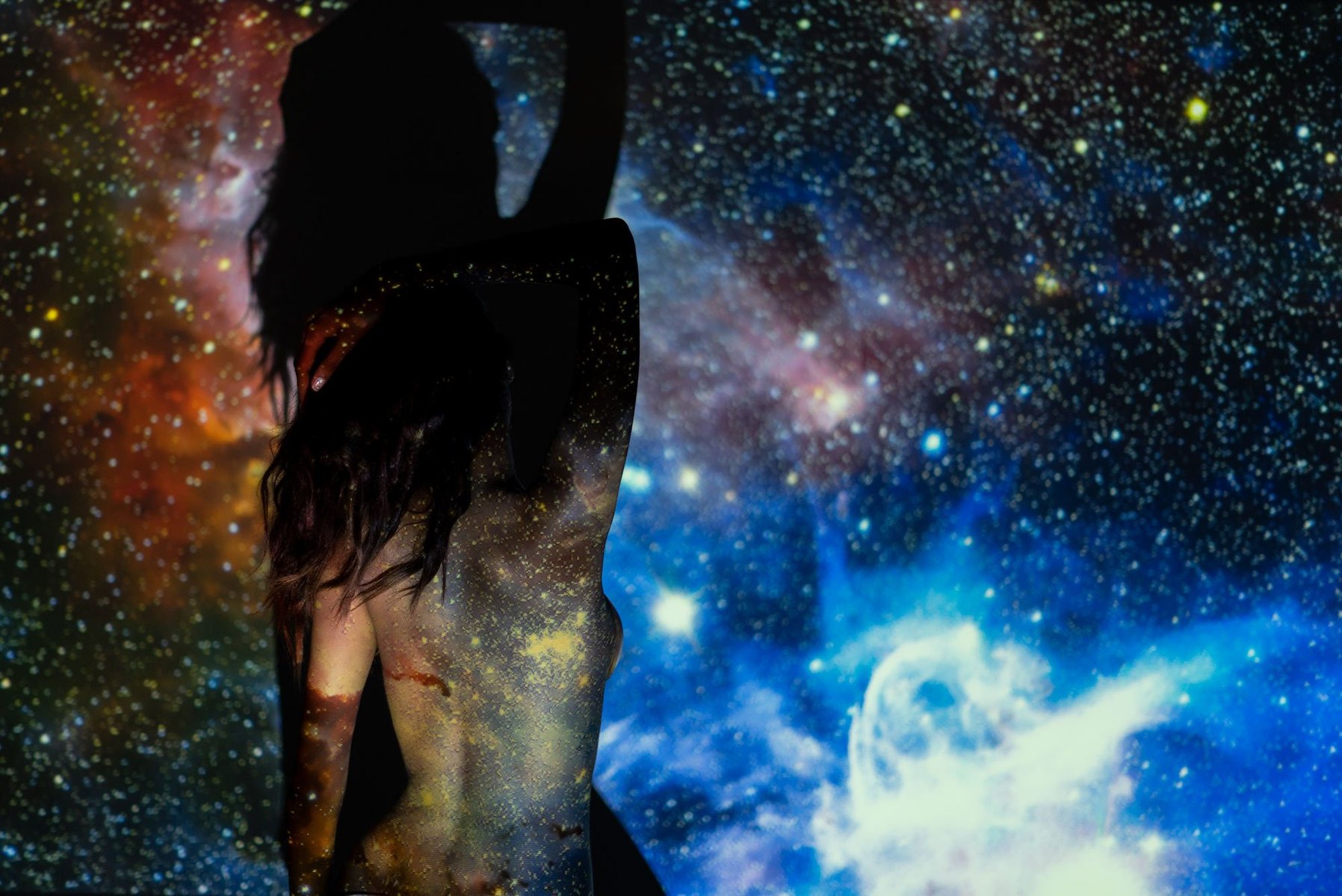 girl standing by the universe concept projector photoshoot by best indian conceptual photographer based in mumbai india