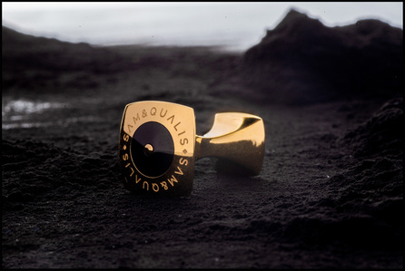 a professional product photoshoot of a golden cufflink concept shoot in outer space on the surface of the moon  by best still life photographer ashish gurbani based in Mumbai India