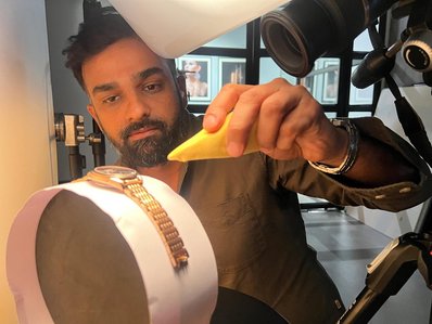 behind the scenes with lifestyle photographer shooting a luxury watch in a studio setup for upcoming new collection for argos watches india