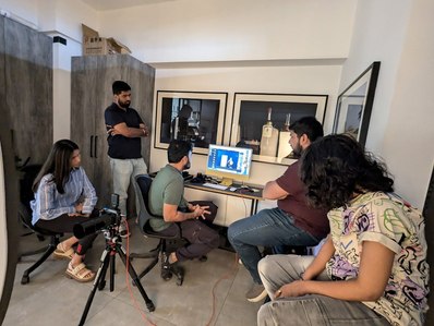 the entire creative agency sitting at leading advertising photographers studio evaluating the product bottle shoot images in mumbai