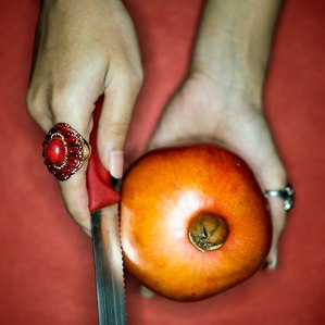 cutting a pomegranate concept cutting fruit with fashion shoot top indian fashion photographer based in mumbai india