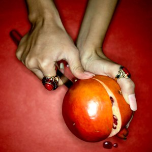 fashion concept with jewellery cutting a pomegranate shoot by top indian commercial photographer based in mumbai india