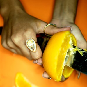 fashion concept cutting an orange shoot by top indian conceptual jewellery photographer based in mumbai india