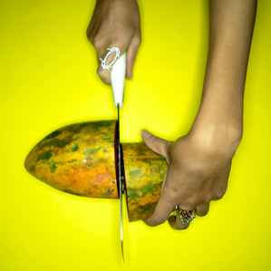 cutting a papaya fruit concept shoot by top indian advertising photographer based in mumbai india