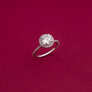 solitaire diamond ring shot on a pink background in a studio setup using multiple focus stacking technique on medium format hasselblad camera photographed by one of the most creative luxury jewellery photographer based in mumbai india