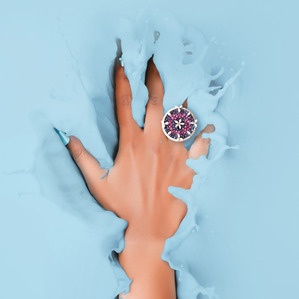 a concept shoot of a hand splashing in coloured liquid with diamond jewellery on photoshoot by top advertising photographer ashish gurbani based in mumbai india
