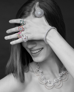 a gorgeous fashion model wears diamond and precious stone jewelry for a photoshoot with the best advertising photographer based in Pune india