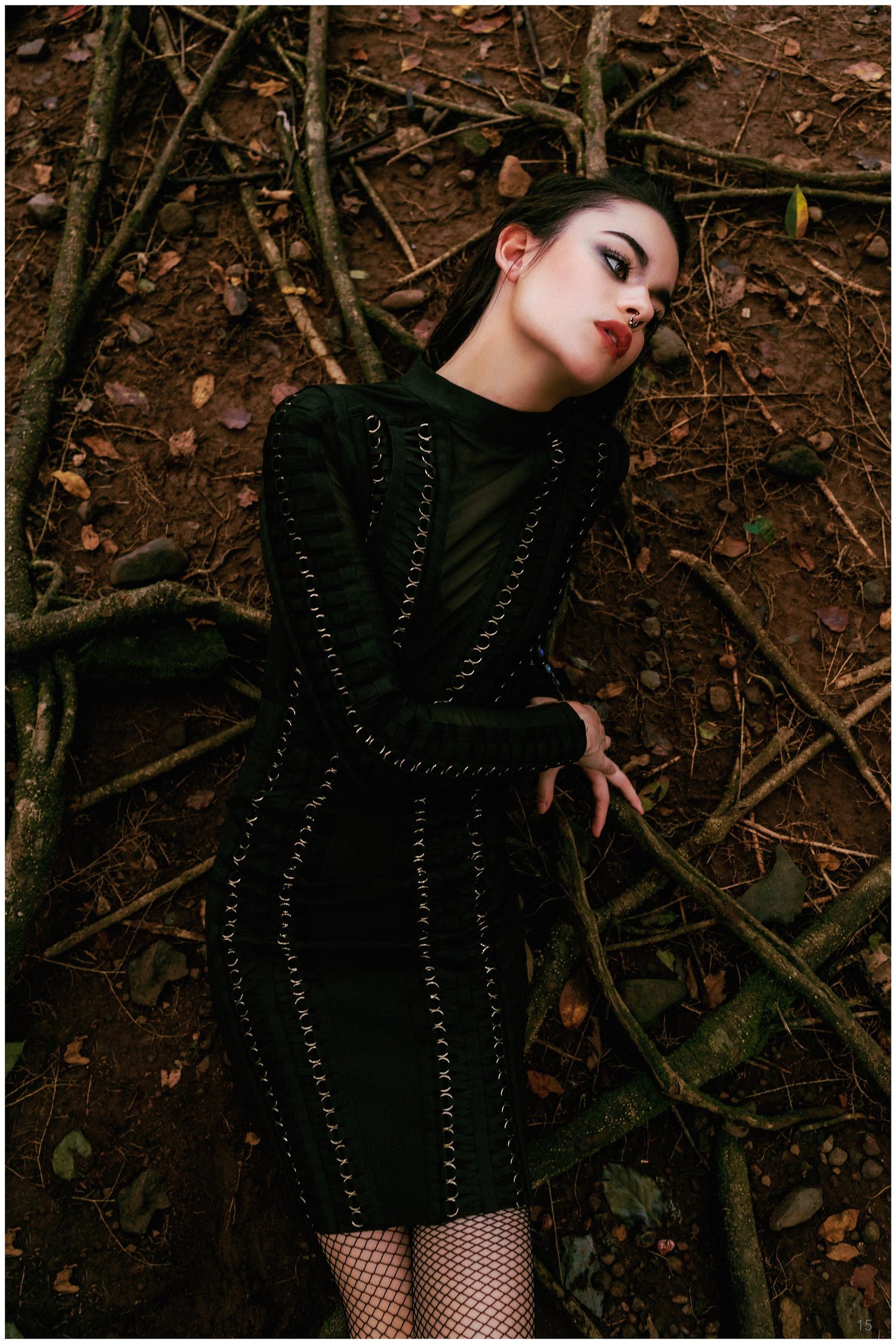 model posing as a witch sitting over the roots of a tree shot upside down by Ashish Gurbani leading advertising photographer based in Mumbai India.