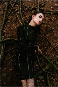 model posing as a witch sitting over the roots of a tree shot upside down by Ashish Gurbani leading advertising photographer based in Mumbai India.