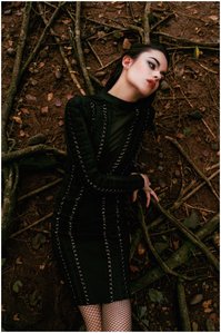 model posing as a witch sitting over the roots of a tree shot upside down by Ashish Gurbani leading advertising photographer based in Mumbai India.