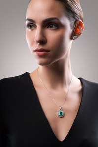 leading jewellery photoshoot of a lady wearing solitaire diamond in studio near me