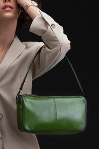 a breatiful green bag hanging on the shoulder of a model for a bag campaign photoshoot by best fashion photographer based in mumbai india\