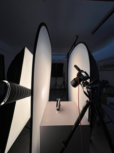 a table top product photography setup shooting a luxury watch on white background creative photoshoot