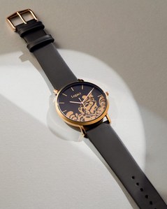 a professional watch photographer captures the details of high end watch in concept studio lighting in mumbai india