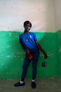 Girl holding a mobile phone, posing in a corner of the room shot by Ashish Gurbani top travel photographer based in Mumbai India.