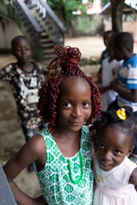 Portrait shot of two sisters in a school compound, enjoying the summer shot by Ashish Gurbani leading fashion photographer based in Mumbai India.