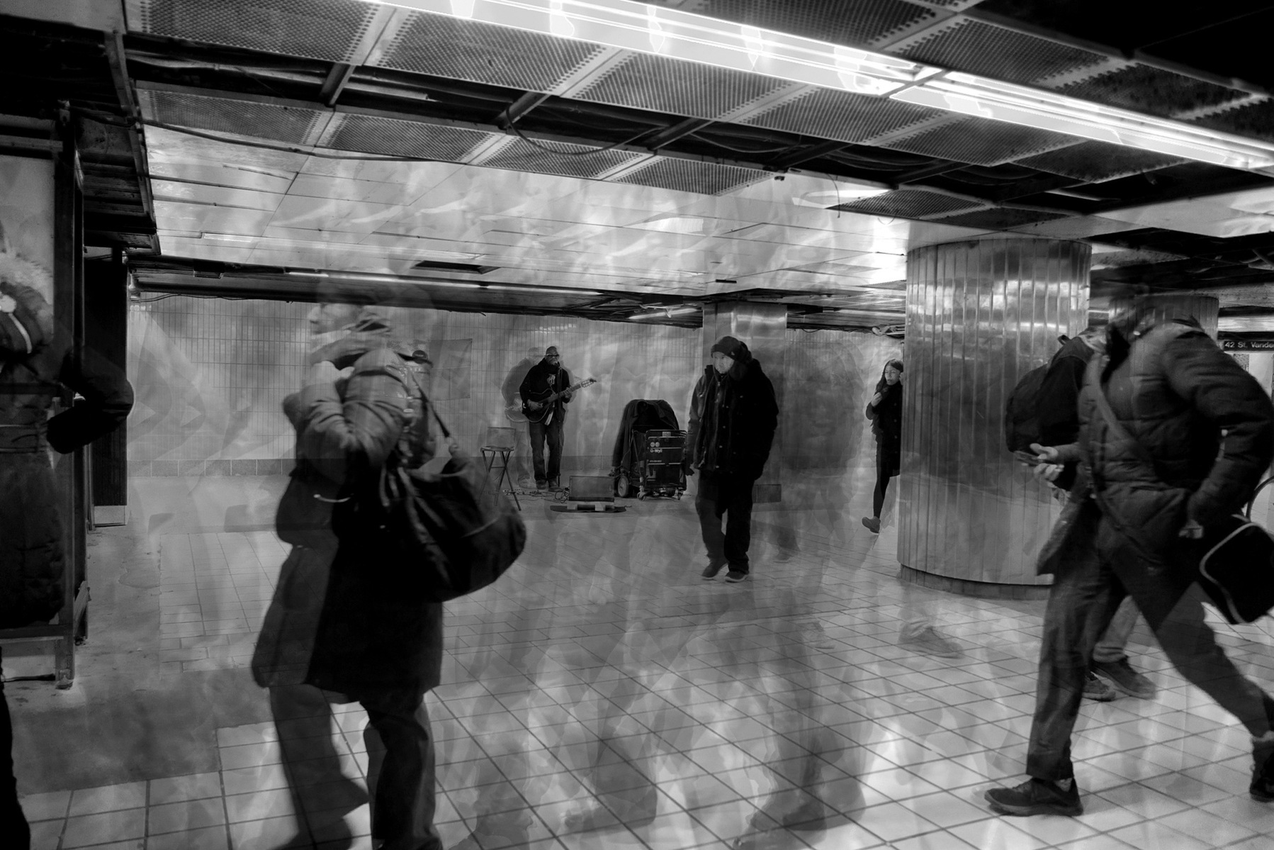 professional photograph of street photography in pre-covid times of a rush of people in black and white shot by best conceptual photographer ashish gurbani based in pune india