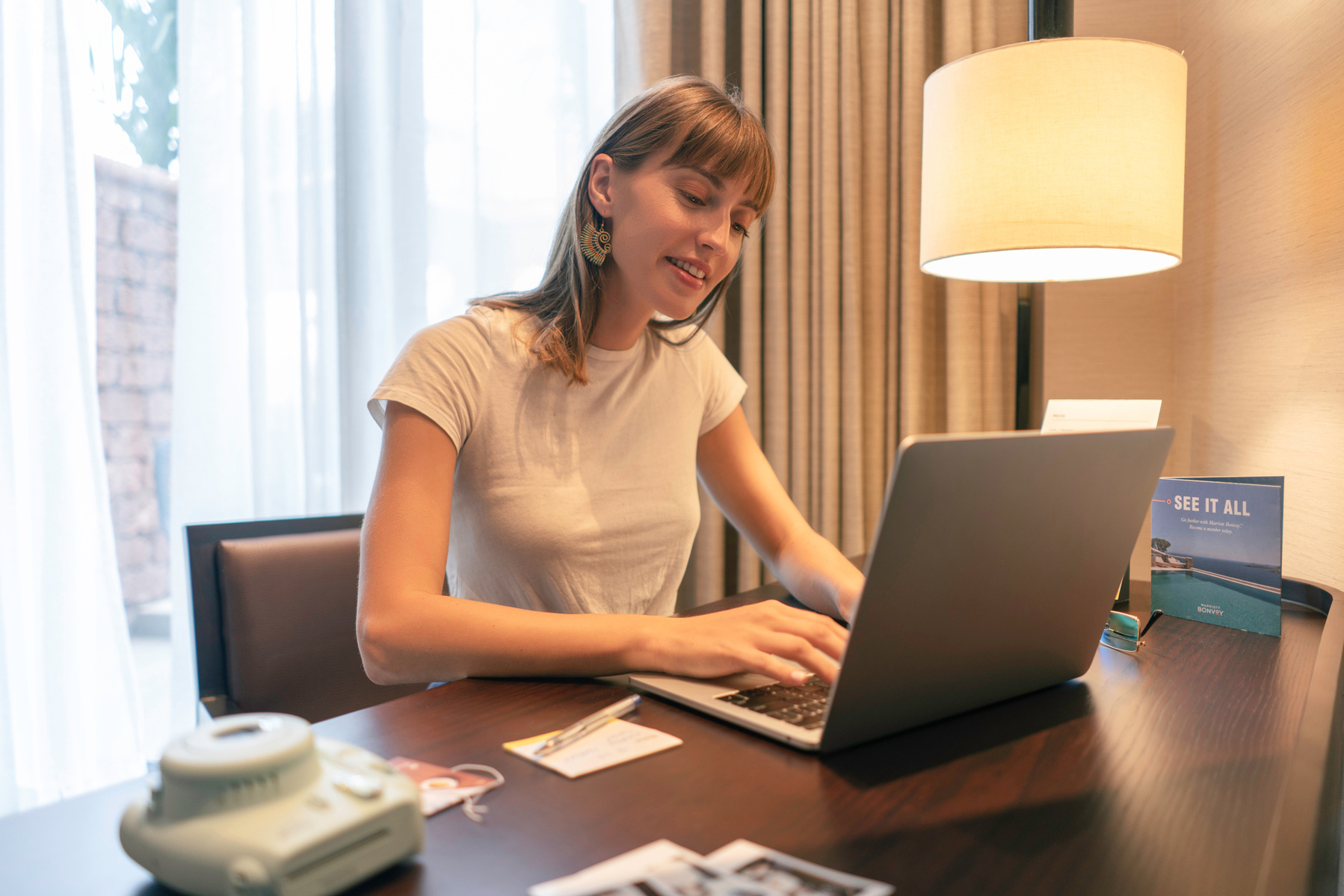 a charming tourist enjoying her laptop working in her cozy hotel room in goa westin shot by leading lifestlye photographer based in mumbai india
