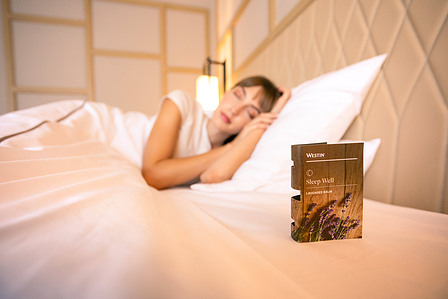 laying down with a beautiful sleep well sign in westin goa for hotel photography shoot with flash lighting and equipment shot by leading portrait photographer based in pune india
